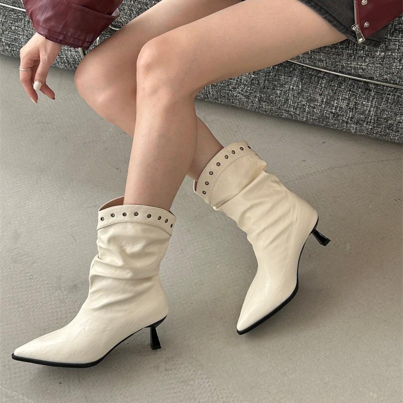 French pointed high-heeled short boots women's shoes 2025 new autumn and winter temperament pleated piled boots stiletto rivets small bare boots