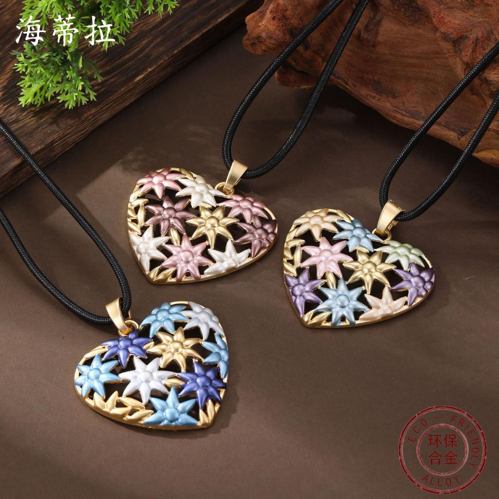 New enamel color hollow sunflower love long pendant women's high sense heart long necklace