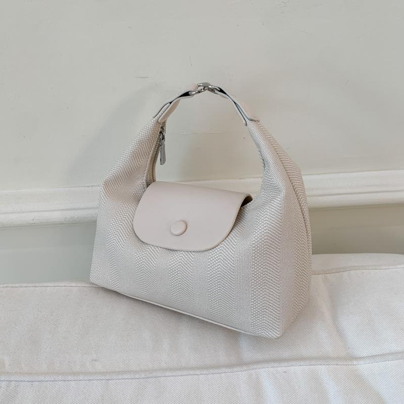 Lässige Tasche Damen Sommer neue Mode Nischendesign Umhängetasche tragbare Knödeltasche