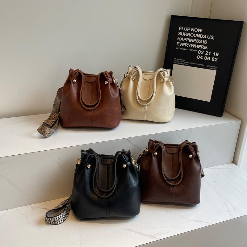 Versatile Korean High-End Bucket Bag: Spring & Autumn 2026 Wide Strap Crossbody Handbag for Women