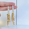 High-End Heart Tassel Earrings: Slimming, Long Dangle for Round Faces - Luxurious and Niche Design