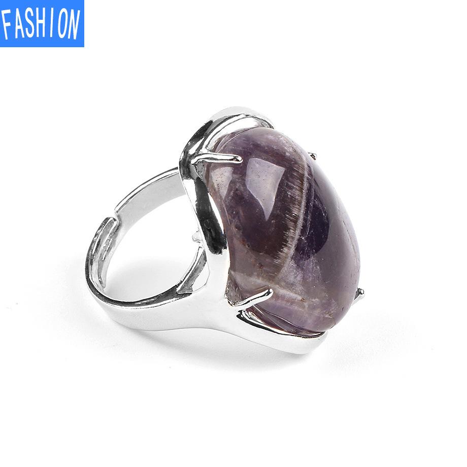 Natürlicher ovaler Kristallring mit vier Krallen