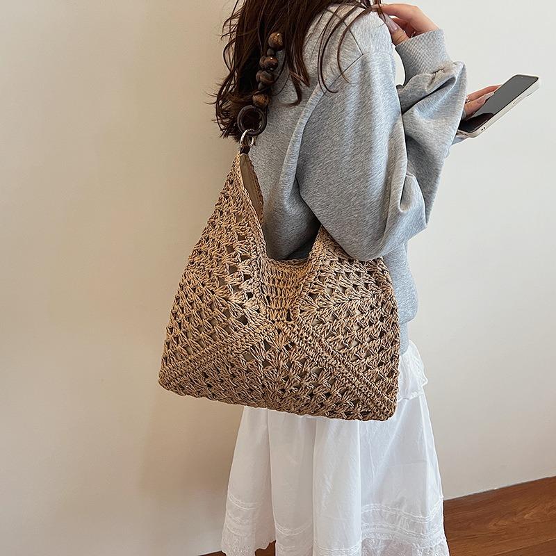 Large capacity hollow bag women's summer new versatile shoulder messenger bag woven seaside beach bag