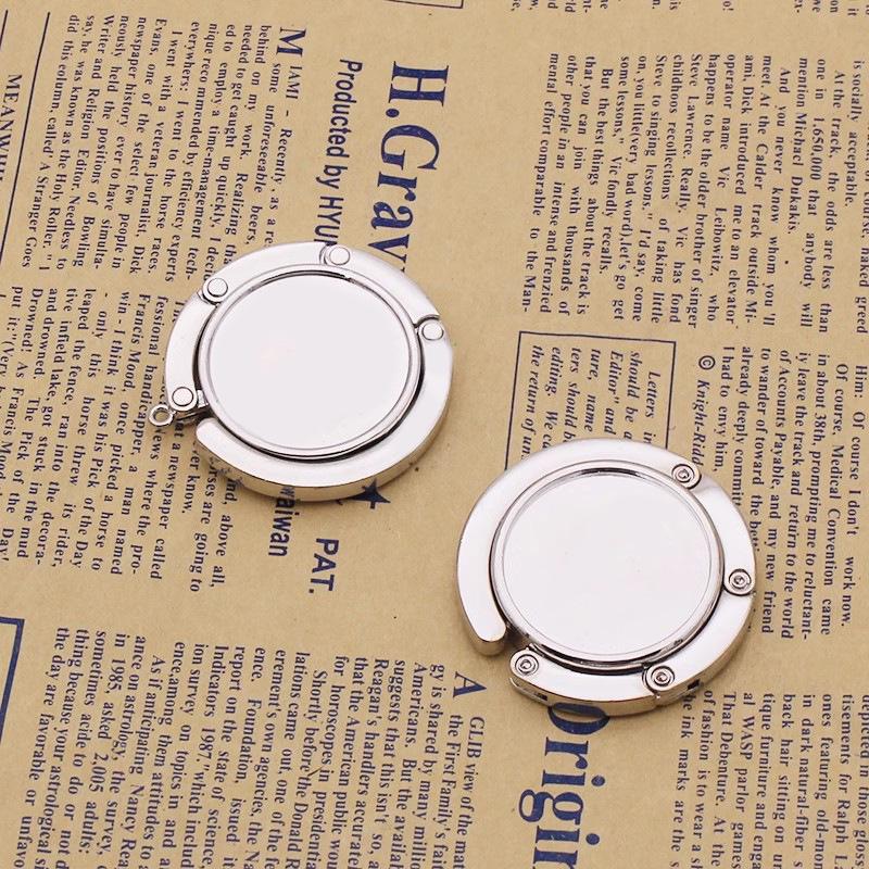 Tragbarer Faltbarer Handtaschenhaken - Kreatives Rundes Metall-Souvenir