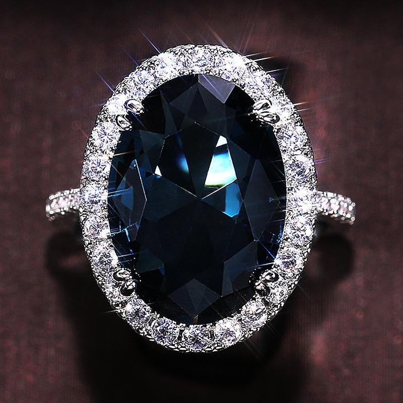 Cao Shi Wish Elegant Peacock Blue Zircon Egg-Shaped Ring for Women - Anniversary Celebration Accessory.