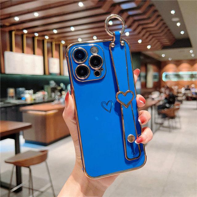 Funda para teléfono con correa de muñeca chapada para iPhone 14 13 12 11 Pro Max Xs Max Xr 13pro 14 Plus 11 a prueba de golpes suave parachoques amor corazón cubierta