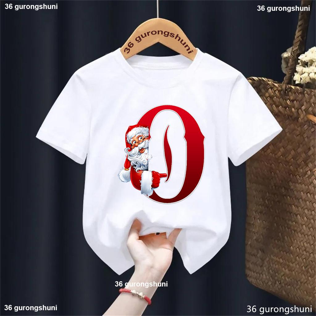 Lustiges Weihnachtsmann 26 Buchstaben T-Shirt Geburtstag Name Geschenk T-Shirt Frohes Neues Jahr 2025 Partygeschenk Jungen Mädchen Kinder Kleidung Oberteile