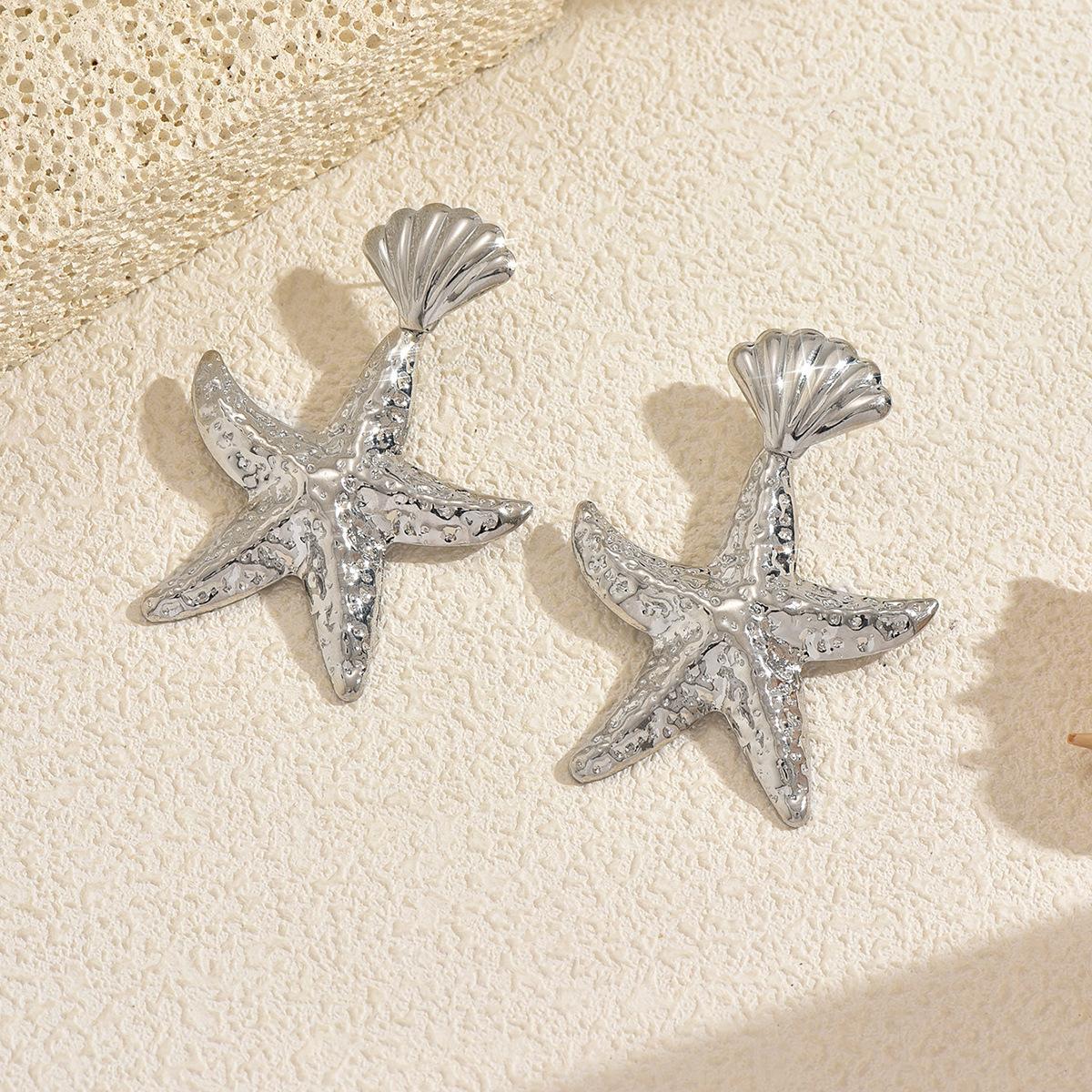 

Gold earrings European and American irregular starfish earrings women s beach vacation pleated texture exaggerated stud earrings