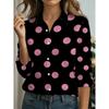 Camicia a maniche lunghe con stampa a pois bianchi su sfondo nero e rosa, che persegue uno stile fashion e retrò, con un accattivante design a pois rosa all-over