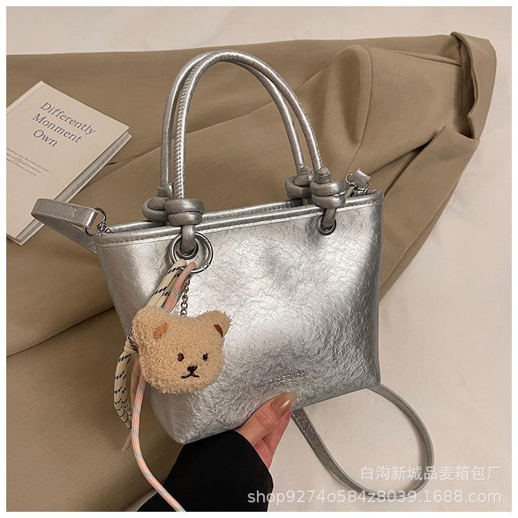 High-end hand-held bag women's 2025 new crossbody bucket bag winter trend texture versatile shoulder bag