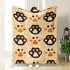 The Pattern Features Repeated Black and Orange Paw Prints On a Beige Background. for All Seasons Blanket Lunch Break Throw Gift