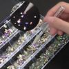 Iridescent Nail Art Rhinestone Set: 24 Grids of Mixed Super Sparkle Flat-Back Rhinestones in Special Shapes with Box Packaging.