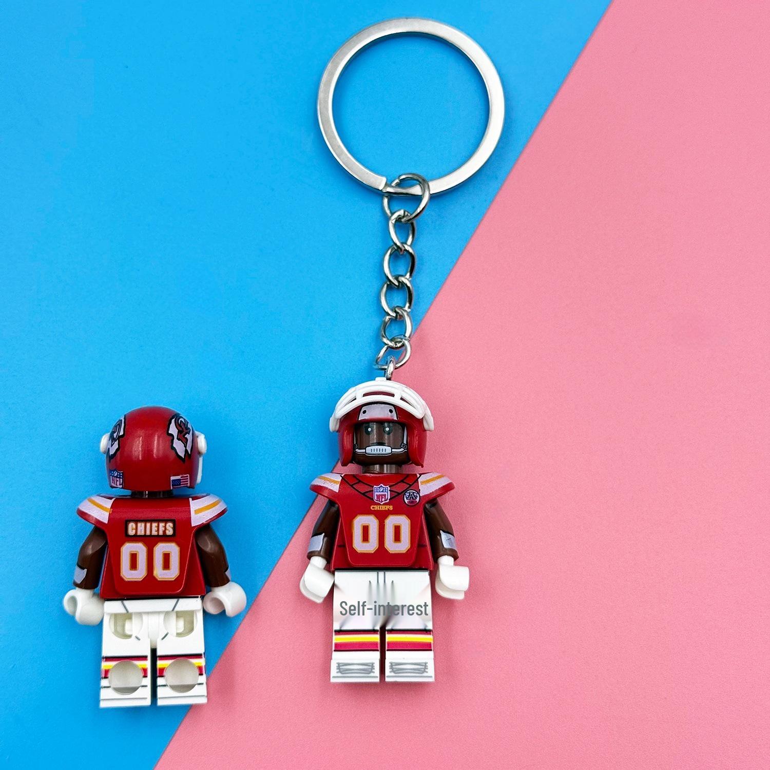 NFL Schlüsselanhänger: Fußballfiguren Bausteine mit Super Bowl Trikot pink