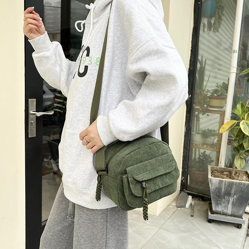 Hot-selling products, striped velvet shoulder messenger bag, corduroy small backpack, men's and women's trendy bags are versatile.