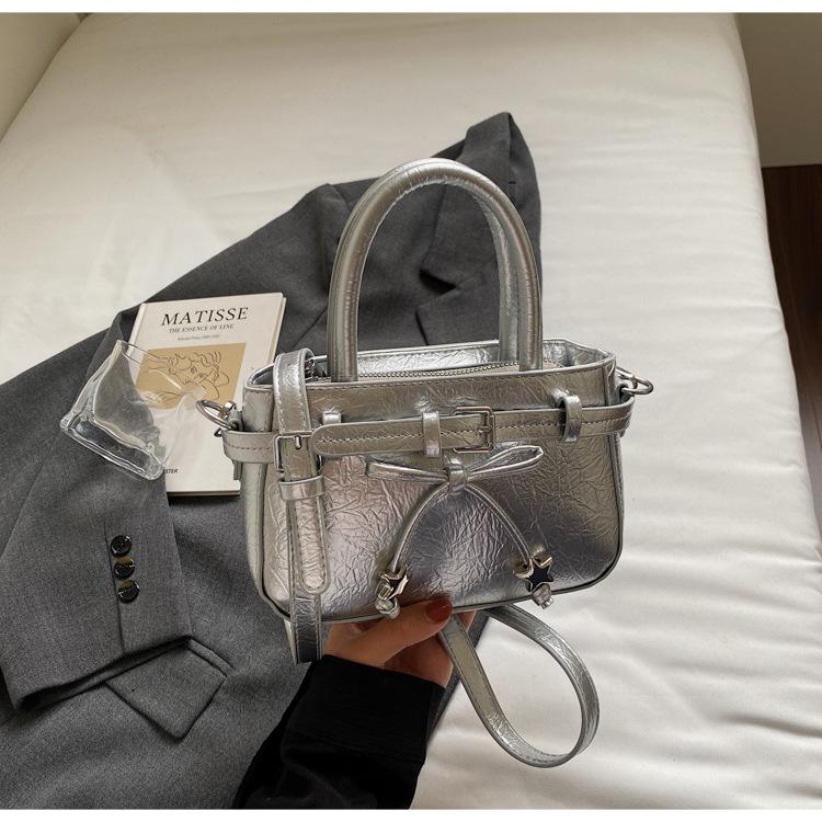 

Retro portable small bag women s tide 2025 new bow niche design women s bag high-end sense versatile messenger bag серебряный