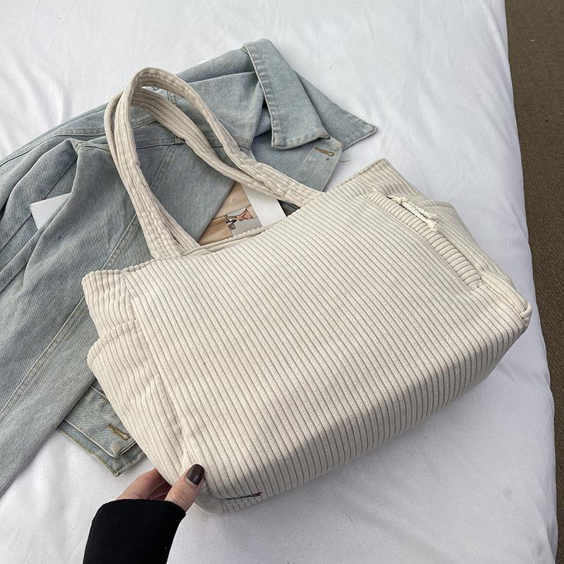 

Strip bag women s large capacity 2025 new autumn and winter leisure tote bag women s commuter shoulder shopping bag
