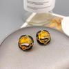 Qingdao Iridescent Geometric Wave Resin Stud Earrings: High-End Retro Fashion for Women