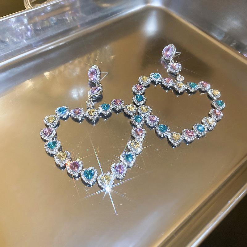 Silver Needle Exaggerated Heart Earrings with Hollow Diamond Design - Luxury European & American Style for Women