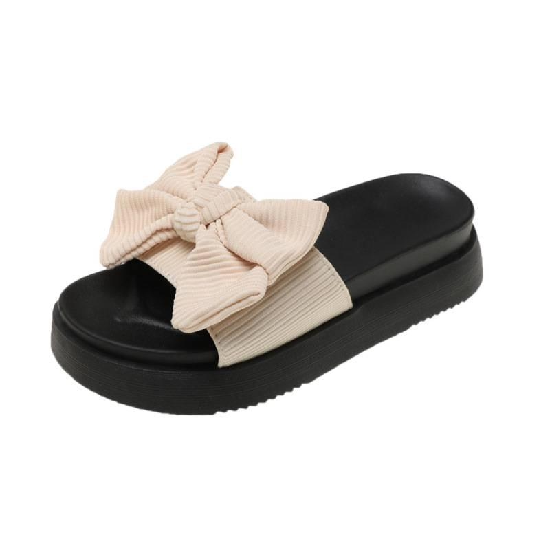 Schwarze, mit Schleife versehene Ein-Wort-Slipper für Damen-Sommerbekleidung, neue Muffin-Dicksohle, rutschfest, fortschrittliche, coole Slipper