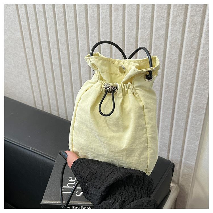 Minimalist style Japan and South Korea light drawstring canvas trend 2025 personalized solid color shoulder crossbody change mobile phone bag women's