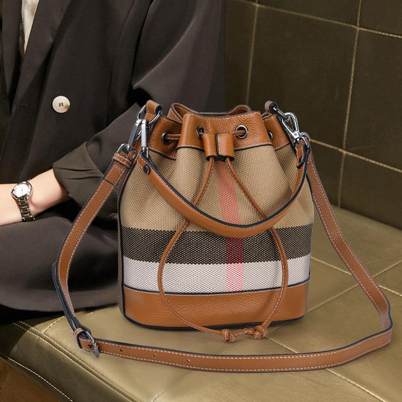 New Hand-held Crossbody Canvas Bucket Bag Drawstring Buckle Large Capacity High-end Niche Shoulder Bag for Women