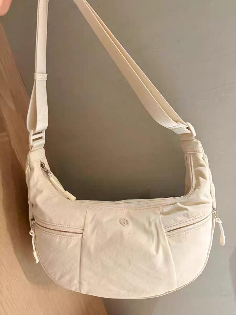 Nanfeng's new products are presented in the middle of the year, milk fu cloud dumpling bags, women's canvas crescent bags, crossbody bags