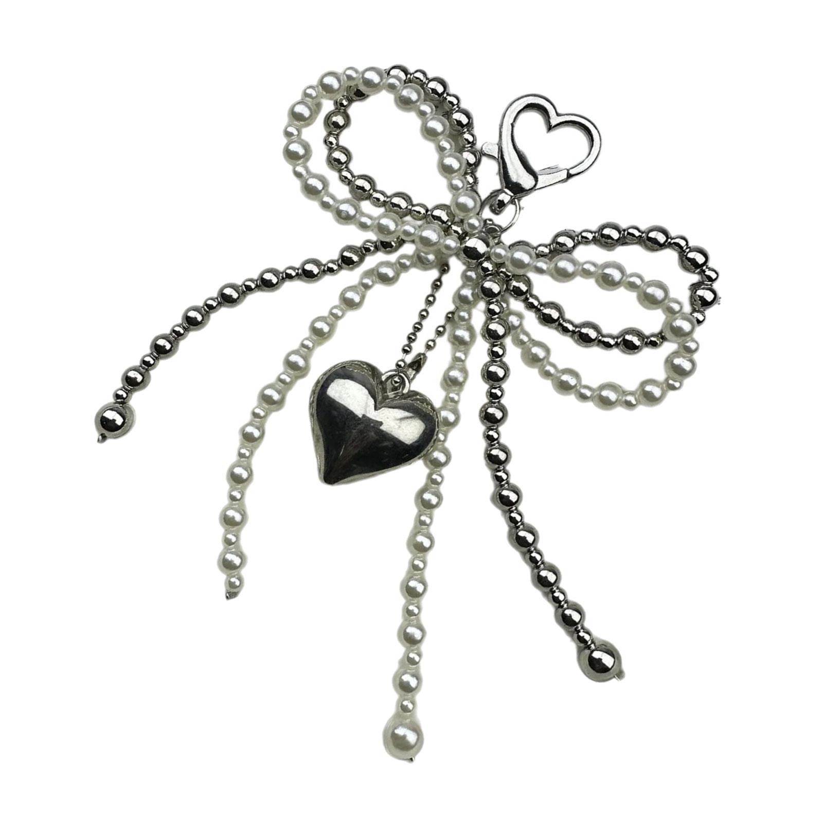 

Стильное подвесное украшение с жемчугом и бантом для чехлов для телефонов и аксессуаров. Идеально для модных женщин. A