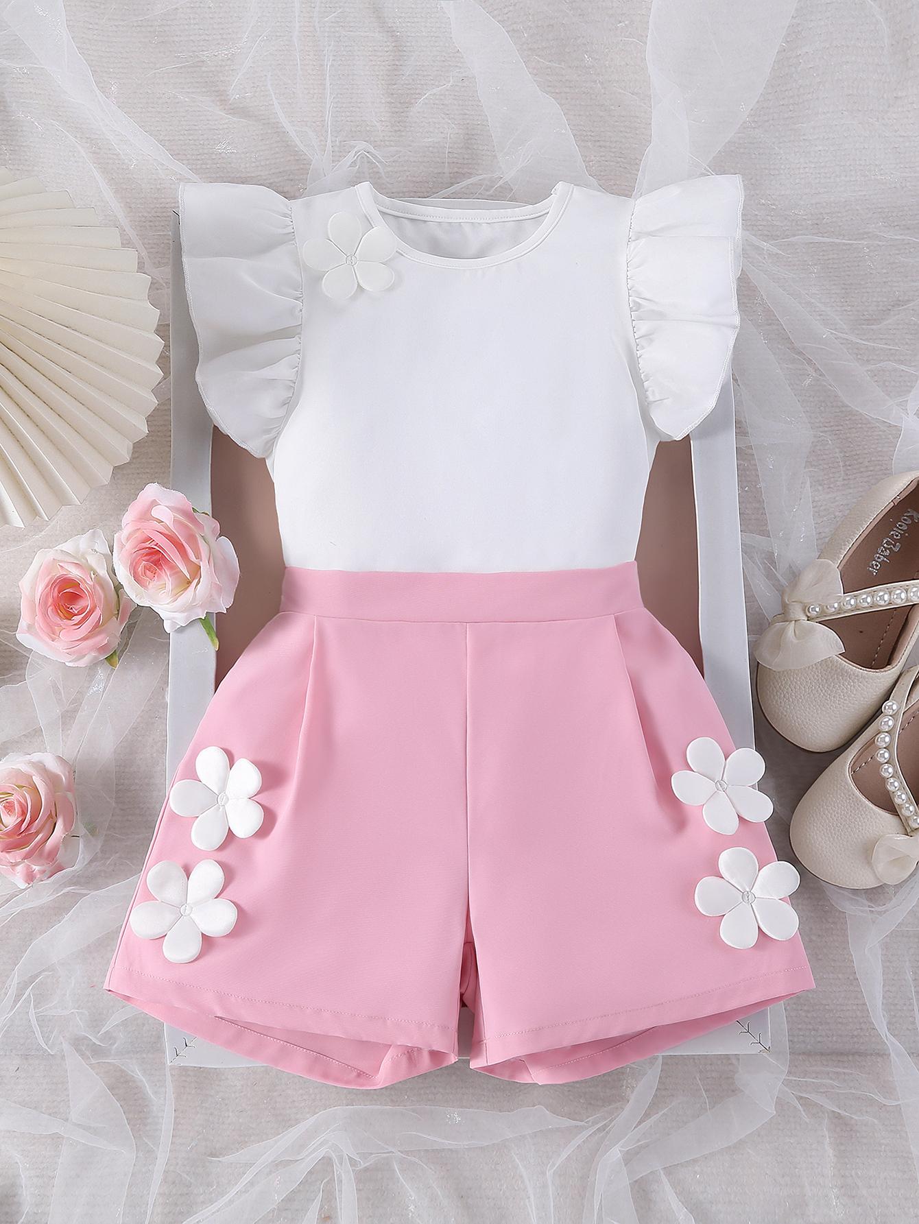 

Two-piece summer bestseller for older girls: a sweet and soft white flutter-sleeved top and simple, thin, pink floral-decorated casual shorts. 12Y рожевий