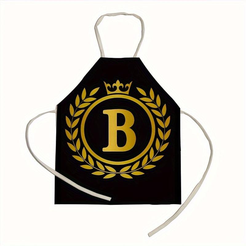 1 personalized letter apron with golden crown print on a black background, suitable for kitchen baking and barbecue