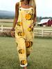 Green jumpsuit with cartoon bee pattern