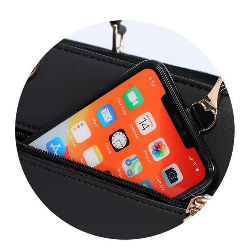 Bolsa pequena transversal decorada com bola de pelo, elegante