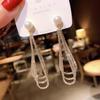 High-End Heart Tassel Earrings: Slimming, Long Dangle for Round Faces - Luxurious and Niche Design