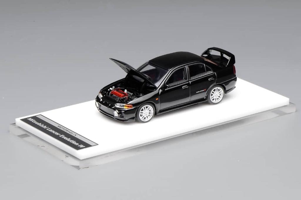 FREESTYLE MOTORHELIX Mitsubishi Lancer Evolution IV Pyrenees Black Pearl Finished Model M64004 1/64