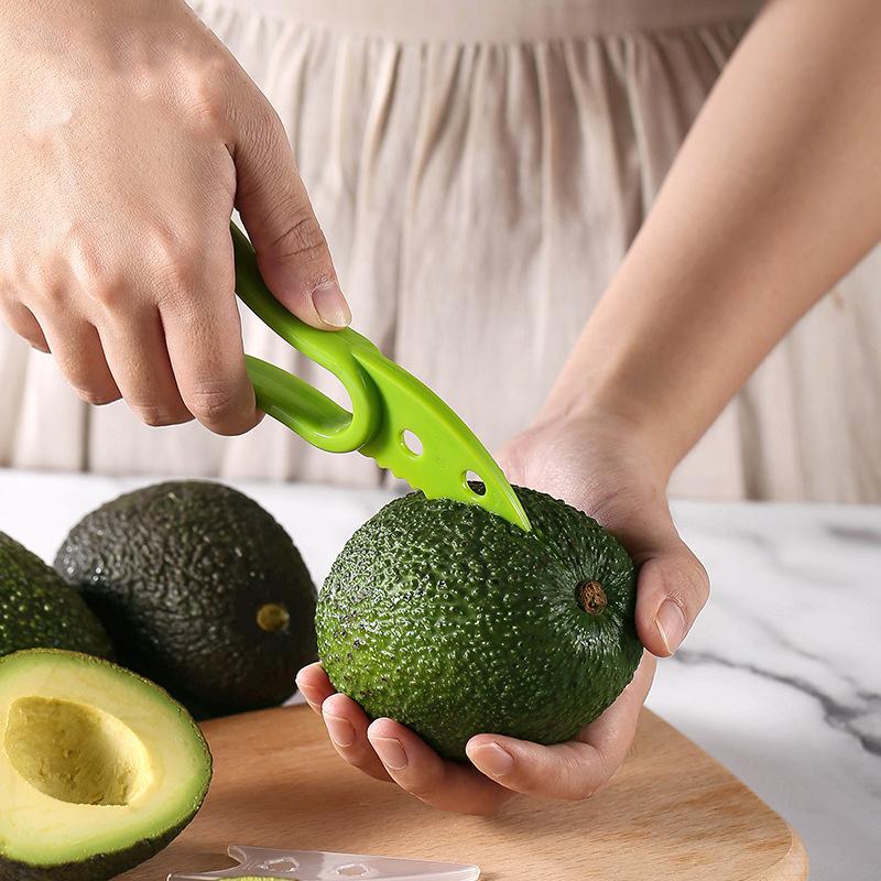 3 In 1 Avocado-Schneider Shea-Entkerner Butterfrucht-Schäler Schneider Fruchtfleisch-Separator Kunststoffmesser Küchengemüsewerkzeuge