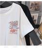 Women's Plus Size Loose Fit Mid-Length Round Neck T-Shirt with Short Sleeves and Slimming Design.