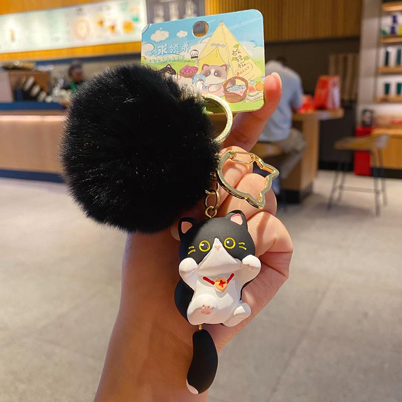 

Energetic Cat Keychain: Trendy Sticky Rice Ball Accessory for Backpacks & Car Keys