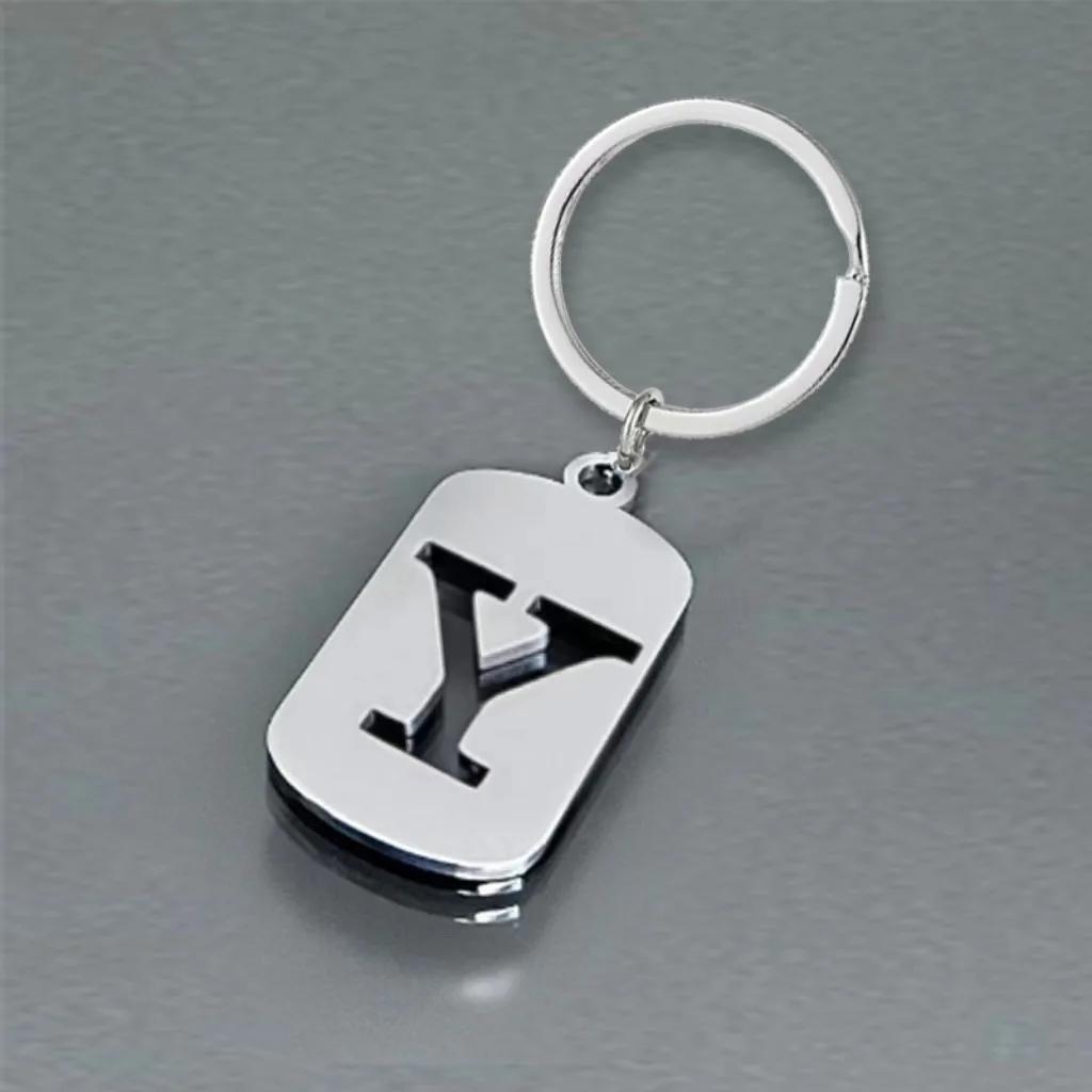 Englischer Buchstaben-Tag-Schlüsselanhänger, glatter Edelstahl, hohl, ABC, personalisierte Schlüsselanhänger, Handtaschen-Ornament