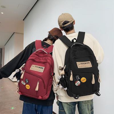 Mochila nova mochila de grande capacidade mochila ensino fundamental médio meninos e meninas mochila escolar bolsa de lazer versátil