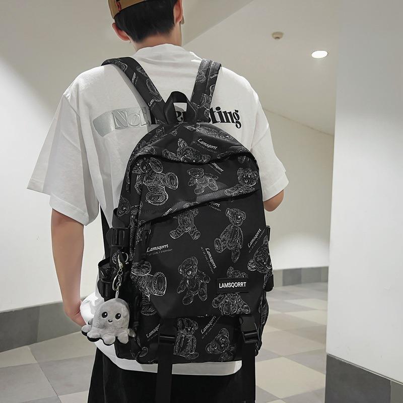 24 New cartoon printed large-capacity junior high school students' male and female school bags, fashionable casual backpacks
