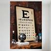 Vintage Eye Chart Metal Tin Sign - Beige Black Text Rows On Rusted Wall, Wooden Table Glass Objects Decor for Home Office Man Ca