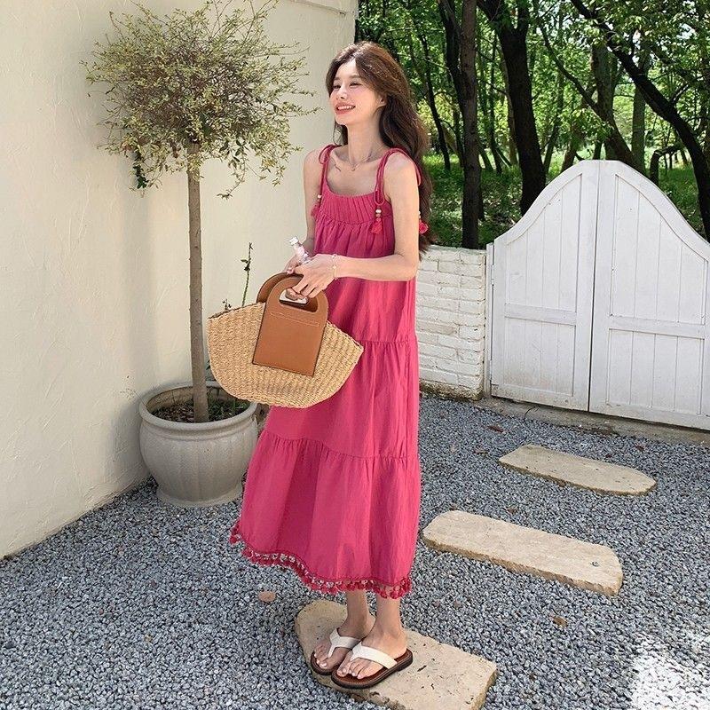 Niche design fringed suspender dress women's summer seaside vacation gentle wind loose and thin temperament long skirt
