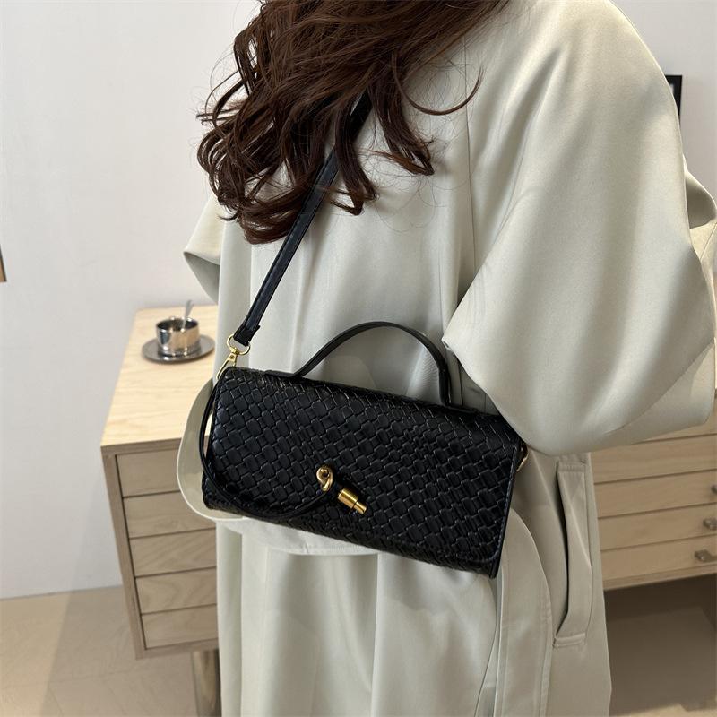 Mode exquisite Weberei 2025 einfarbig lässig Schloss große Kapazität ausländischer Stil horizontal Umhängetasche Baguette Damen Tasche