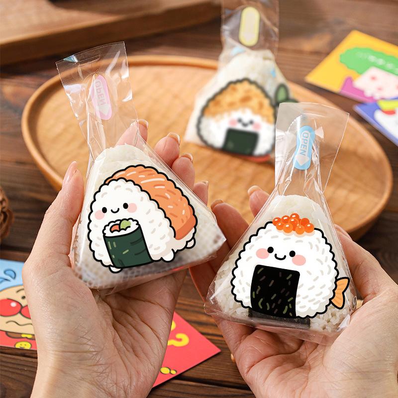 50/100 ks Krásný kreslený trojúhelníkový sáček na balení rýžových koulí mořské řasy Onigiri Sushi Forma na výrobu benta Příslušenství k bento Sáčky na sushi