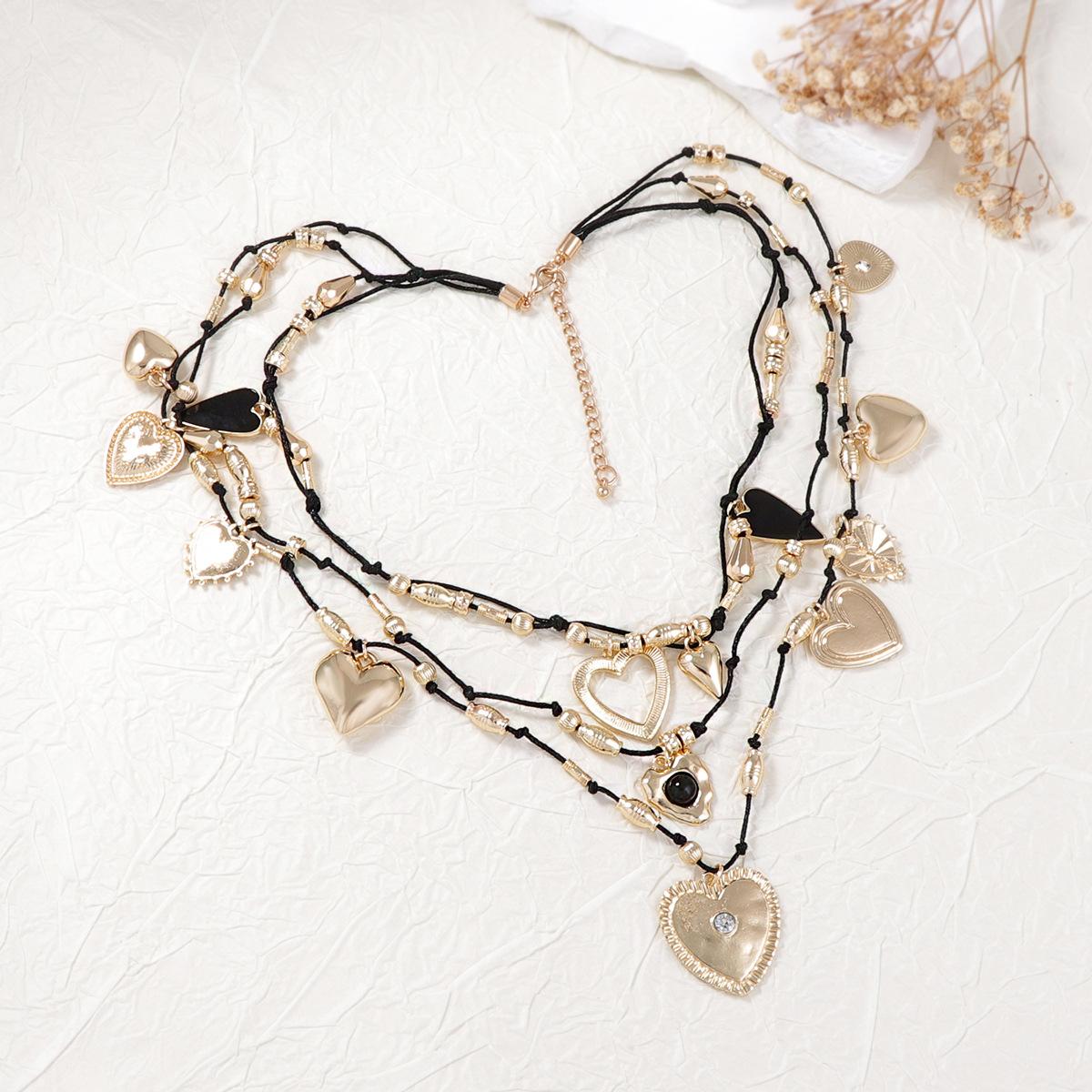 

Особистість ретро тренд багатошарове нашарування носіння сплав шарм любов кулон перебільшене намисто темперамент зрілі жінки золотий