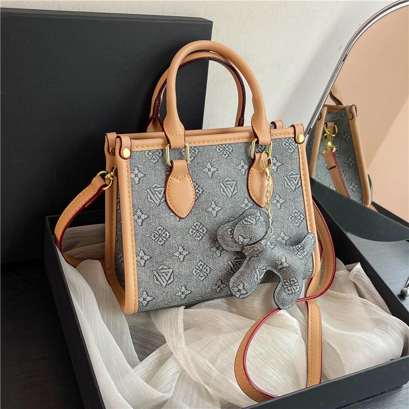 New high-end fashion contrasting color commuter bag portable shoulder oblique span women's bag