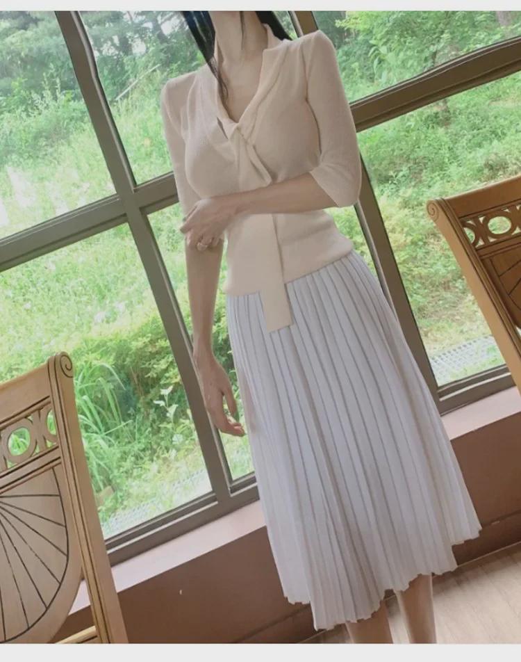 Koreanischer Dongdaemun Slim Fit Strickpullover mit halblangen Ärmeln und Schleifendesign für Damen