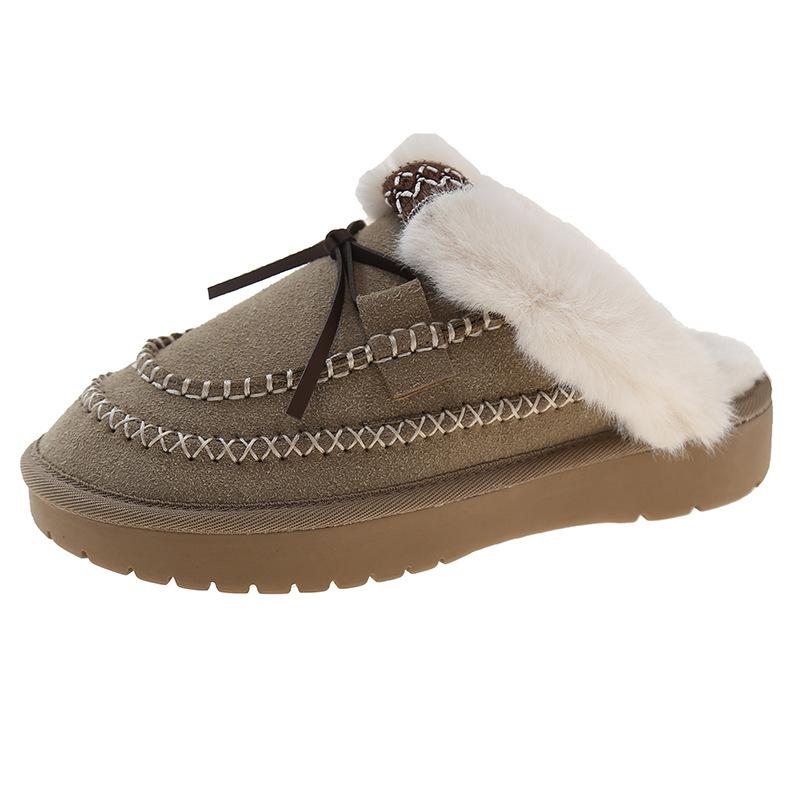In the winter of 2024 thick-soled wool snow boots for women are heightened and thickened to keep warm and half-towed hairy slippers for women