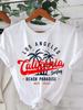 Schwarzes Rundhals-Kurzarm-T-Shirt mit Palmen-Design und Westküsten-Schriftzug Lässige Tops Perfekt für Strandtage Sommer Alltagsmode