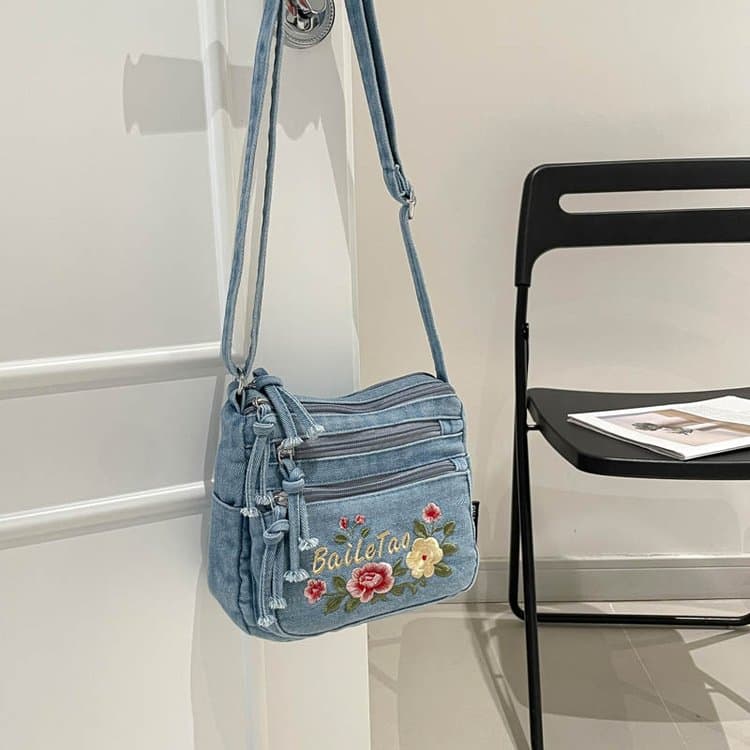 

Denim flower embroidered messenger bag women s shoulder bag світло-синій колір
