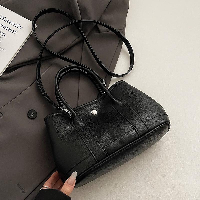 

Оптовая горячая распродажа корейская версия простого стиля однотонная темпераментная портативная сумка-ведро продвинутая текстура для поездок на работу зарубежный стиль сумка-мессенджер w